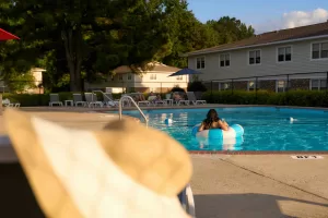 Residents at the community pool at Eastbrook Apartments in Greenville, NC