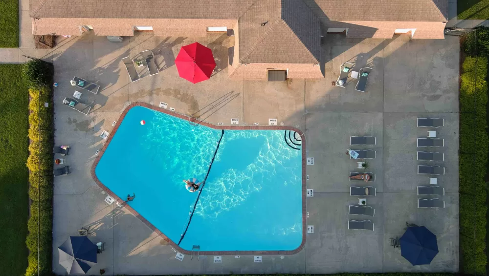 Aerial view of Eastbrook Apartments community and pool in Greenville, NC