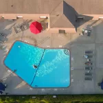 Aerial view of Eastbrook Apartments community and pool in Greenville, NC